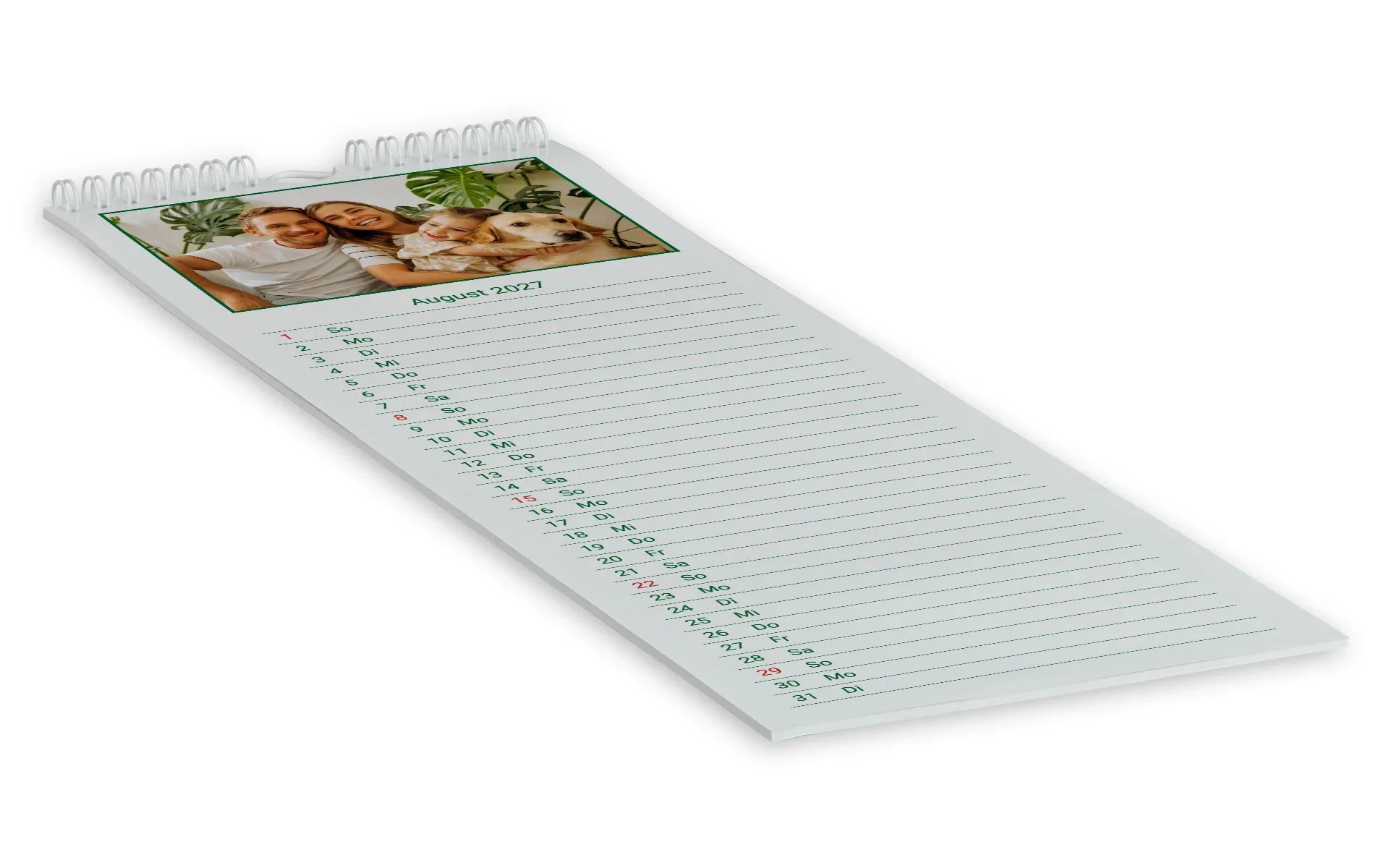 Küchenkalender Ein Küchenkalender zeigt eine Familie mit Hund in einem grünem Rahmen vor weißem Hintergrund.